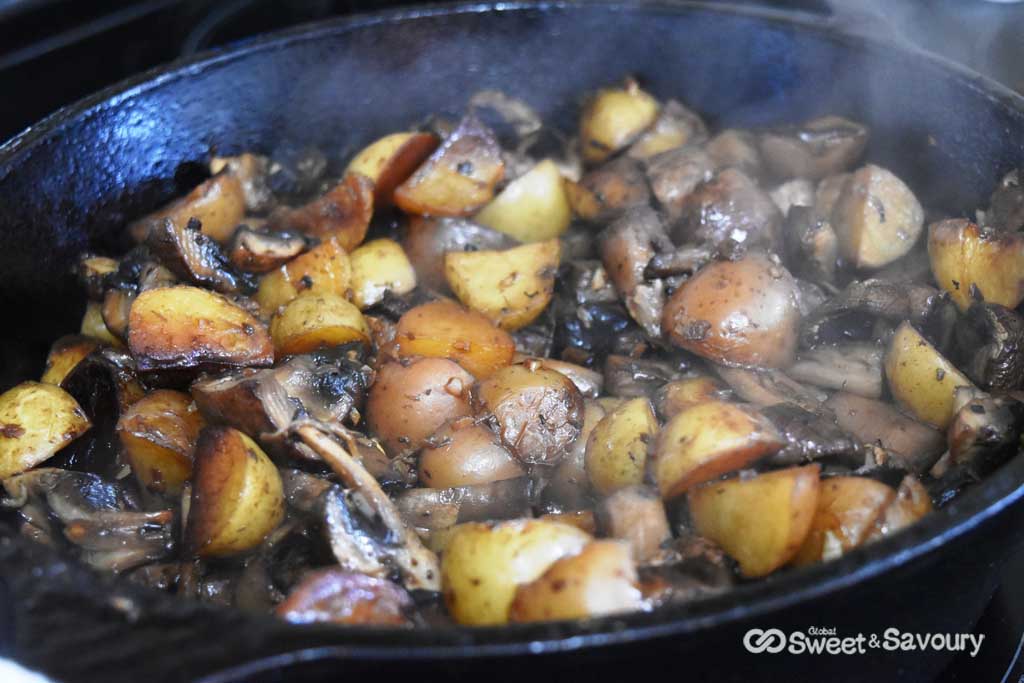 cooking in cast iron potatoes and mushrooms