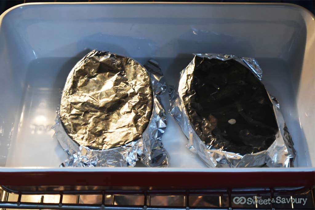 leche flan in waterbath in oven